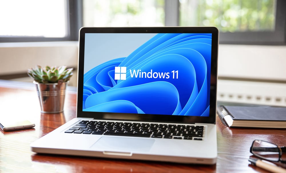 Windows 11 Logo on Laptop - Desk View - Ekaru Web